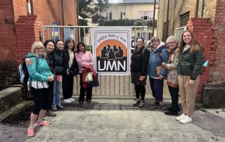 The group standing outside the UMN office