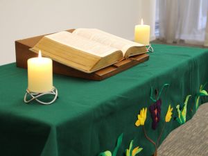 Bible and candles on table