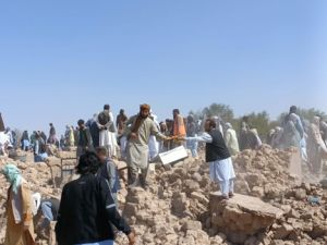 People looking for survivors in rubble